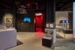 Image showing the galleries and the exterior of the installation, which is surrounded by red velvet curtains, with soundscape by Coda to Coda