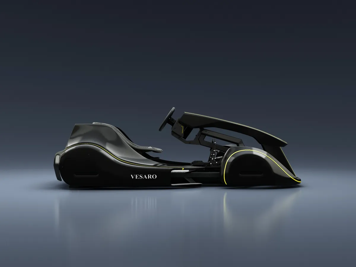 Vesaro Kart simulator in black with yellow accent lines, side profile against a dark studio backdrop