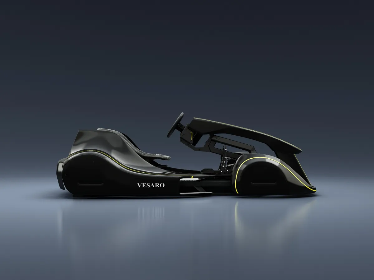 Vesaro Kart simulator in black with yellow accent lines, side profile against a dark studio backdrop
