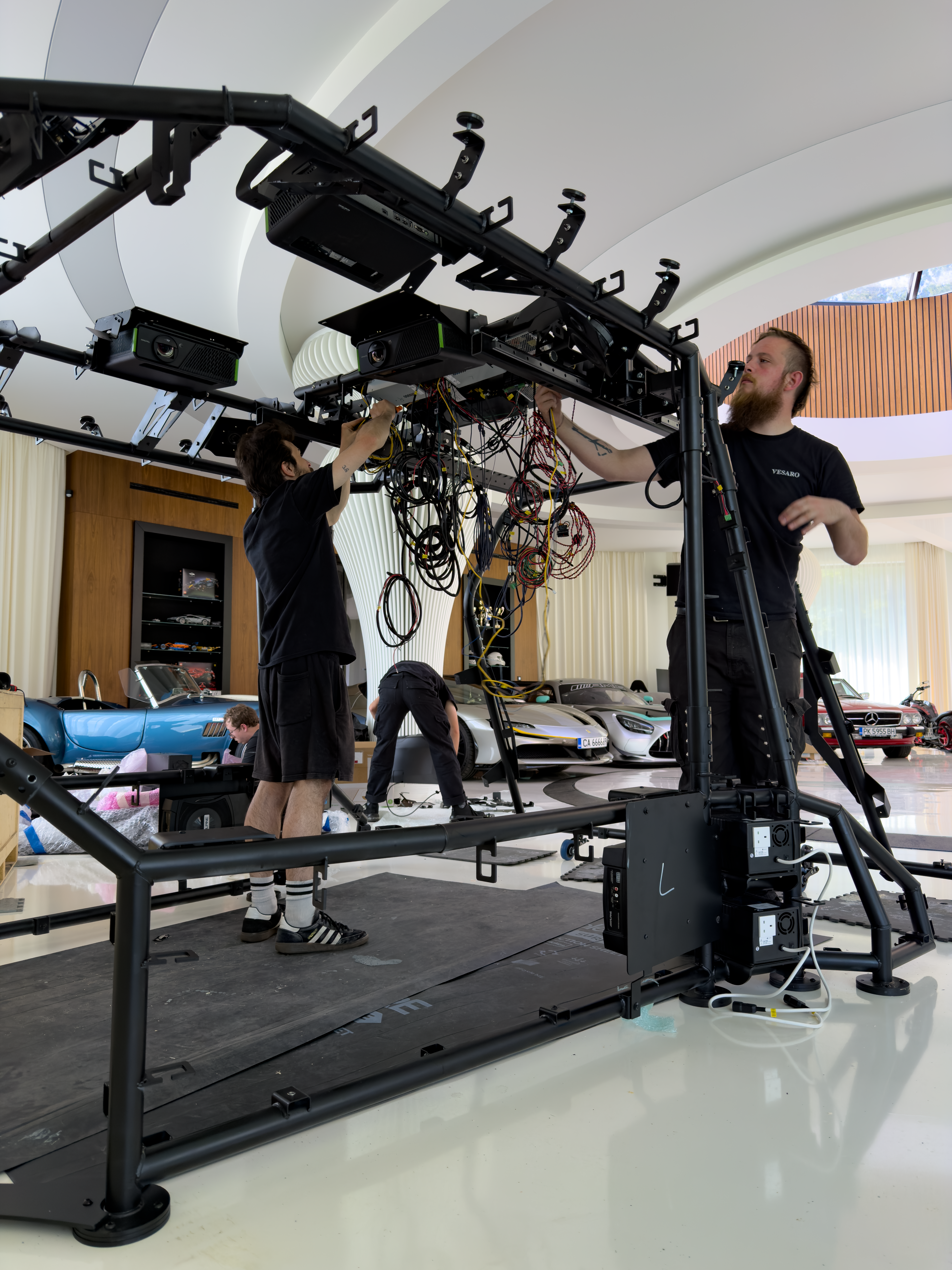 Vesaro engineers installing Dome X projection and audio hardware