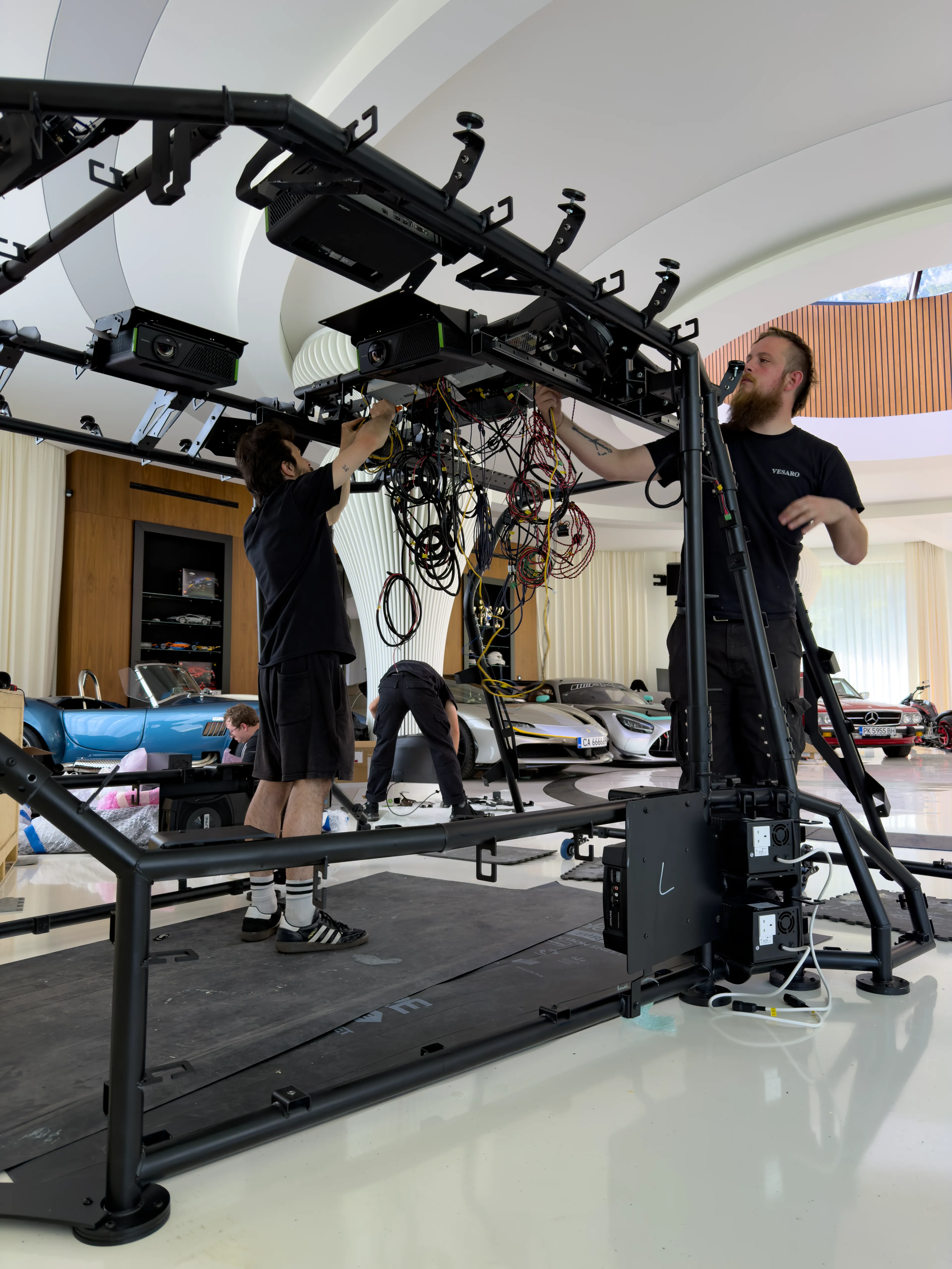 Vesaro engineers installing Dome X projection and audio hardware