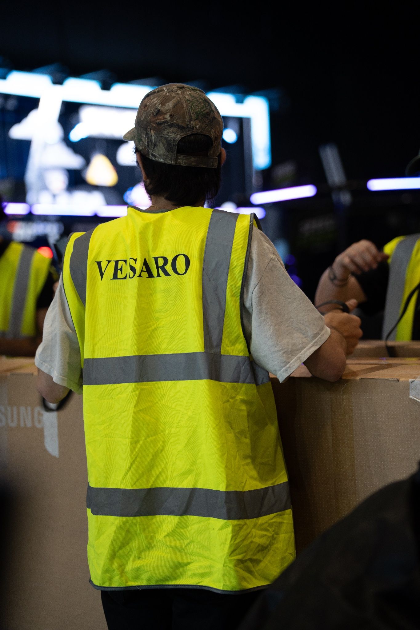 Vesaro crew member in branded hi-vis during the stand build