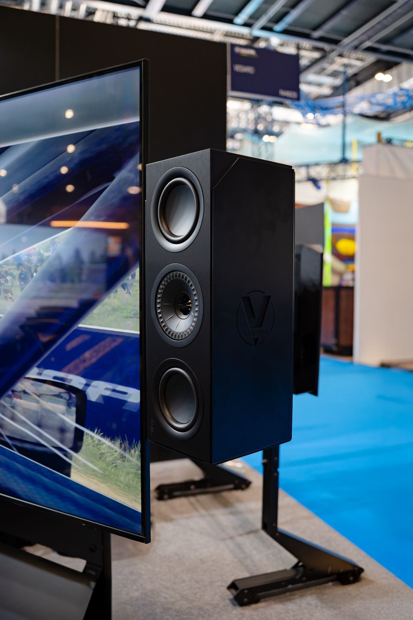 KEF speaker beside one of the Vesaro Rally's 75-inch displays