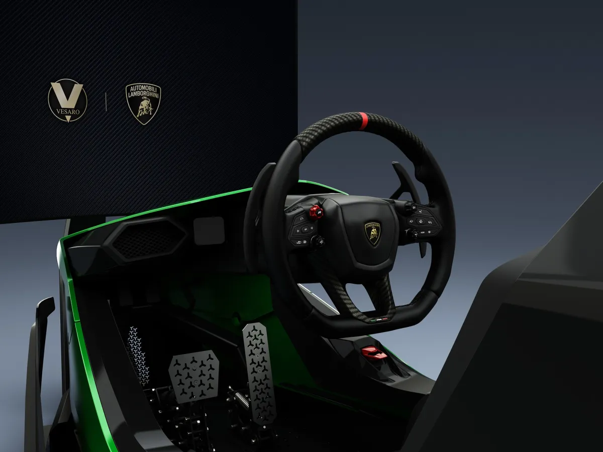 Lamborghini steering wheel and pedals in a green Vesaro Automobili Lamborghini simulator cockpit