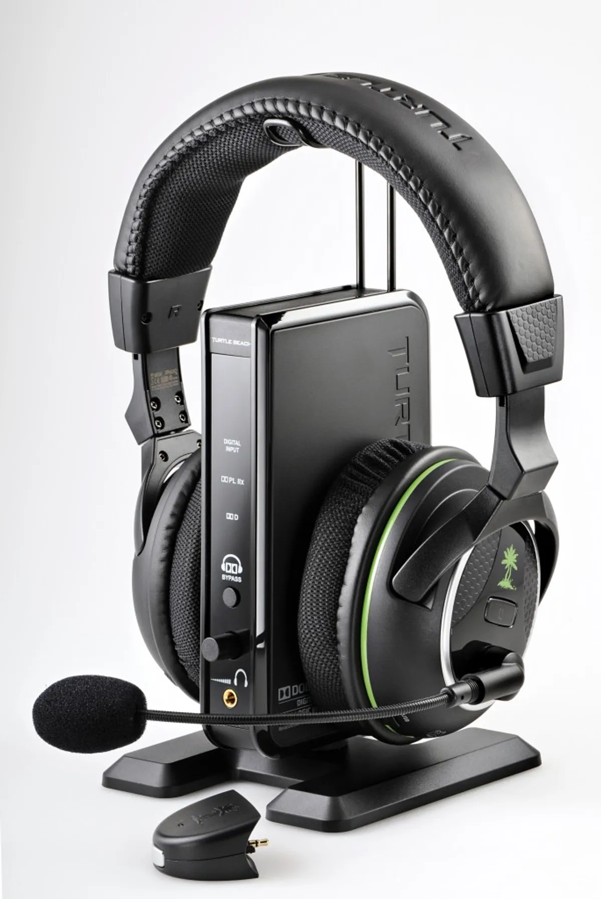 Turtle Beach wireless gaming headset with microphone on its charging stand and USB transmitter