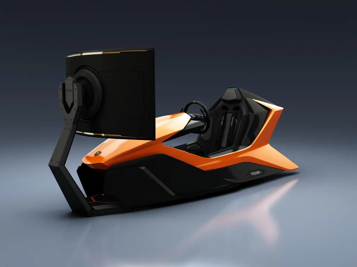 Orange and black Prestigio simulator from the rear three-quarter with a single monitor on a floor stand