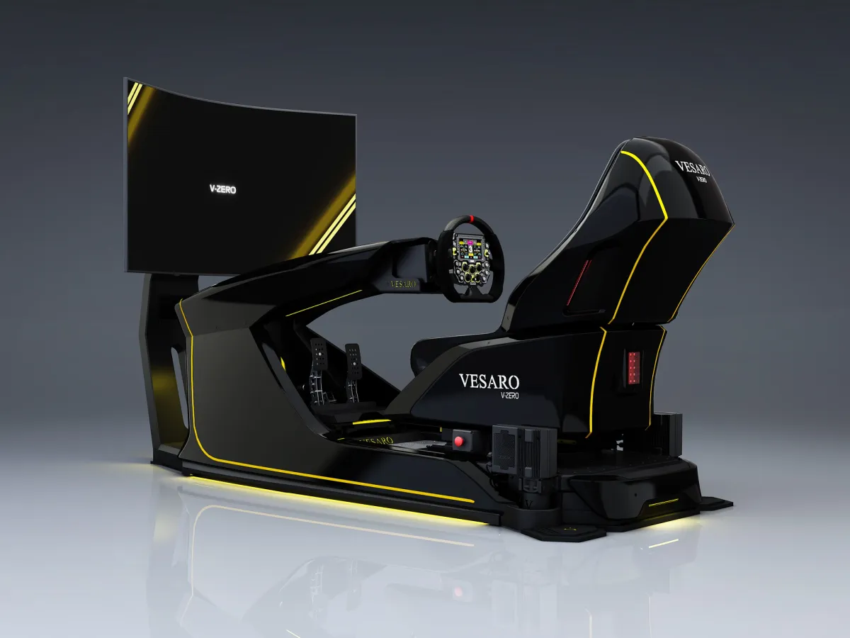 Vesaro V-Zero racing simulator in black with yellow trim, front three-quarter view with a curved display
