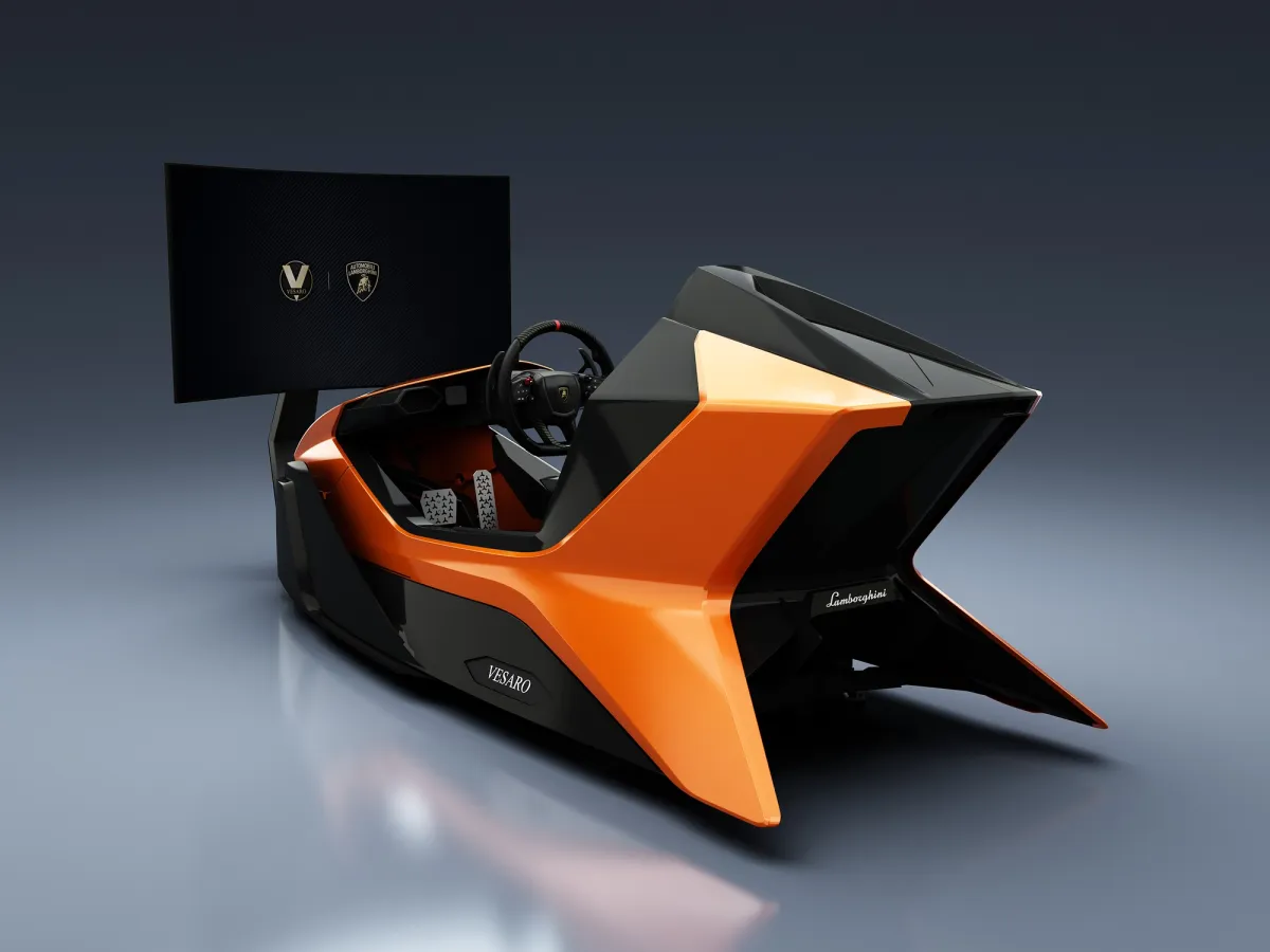 Orange and black Vesaro x Automobili Lamborghini Prestigio simulator with a curved display, front three-quarter view