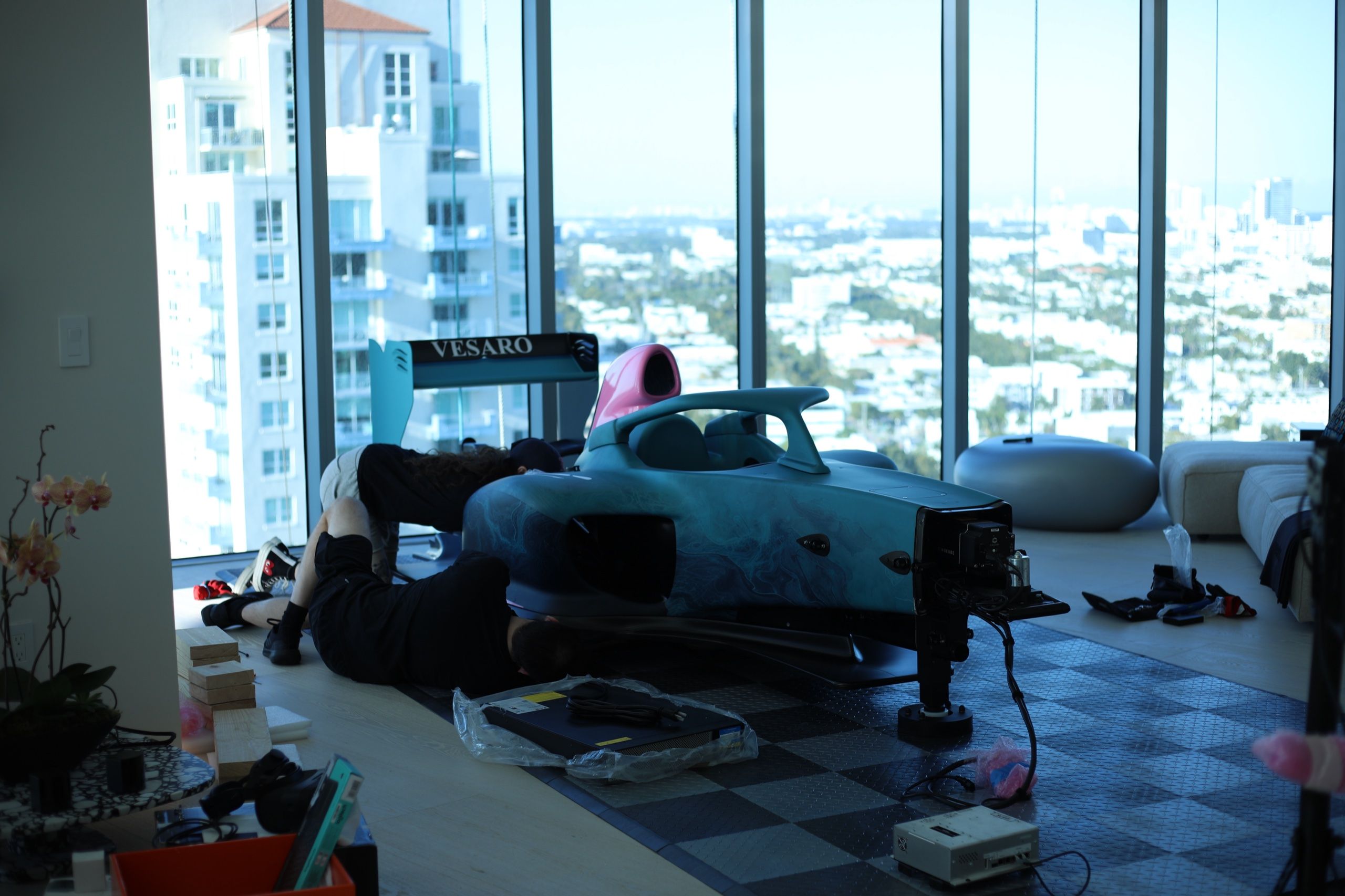 Vesaro technicians installing a formula simulator in a customer's high-rise apartment