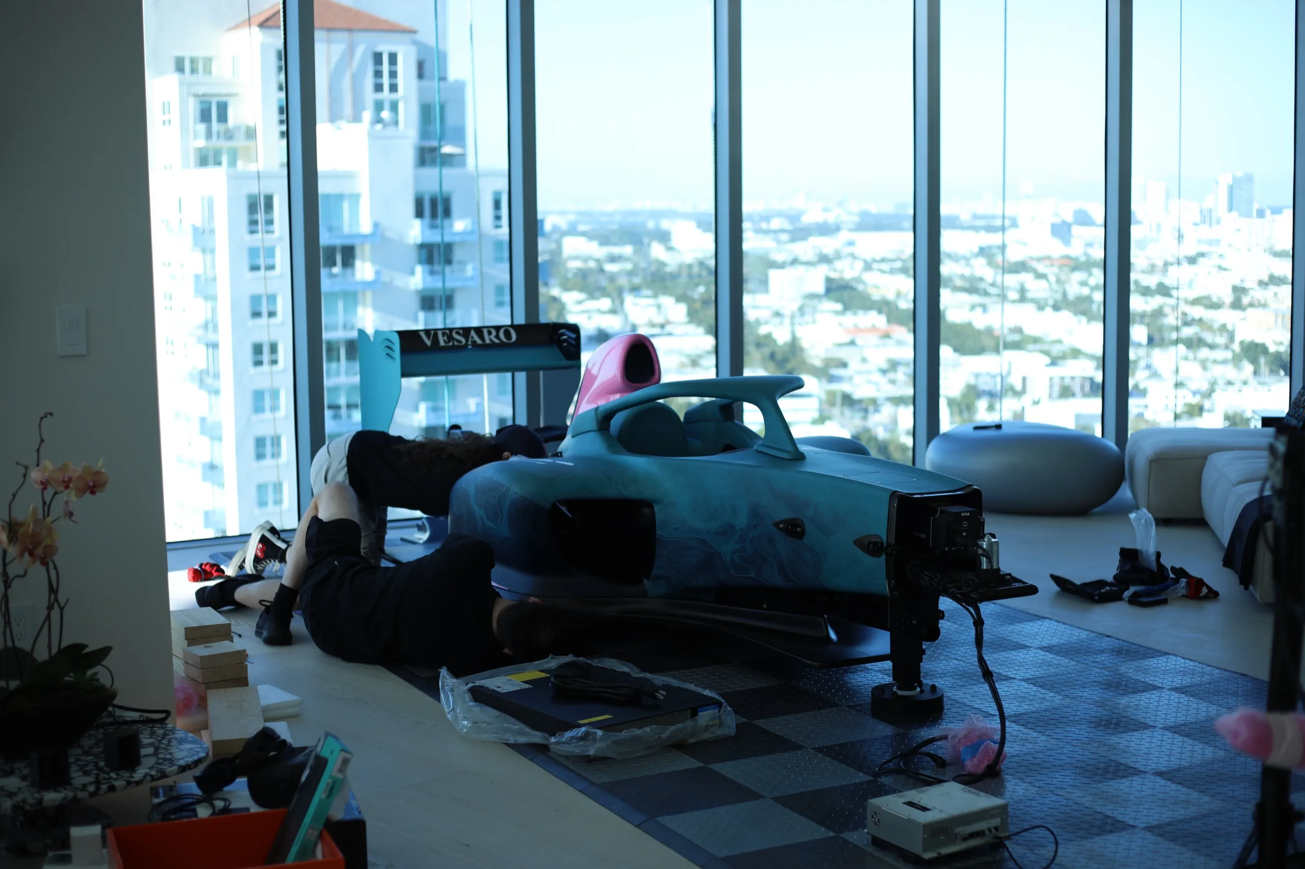 Vesaro technicians installing a formula simulator in a customer's high-rise apartment