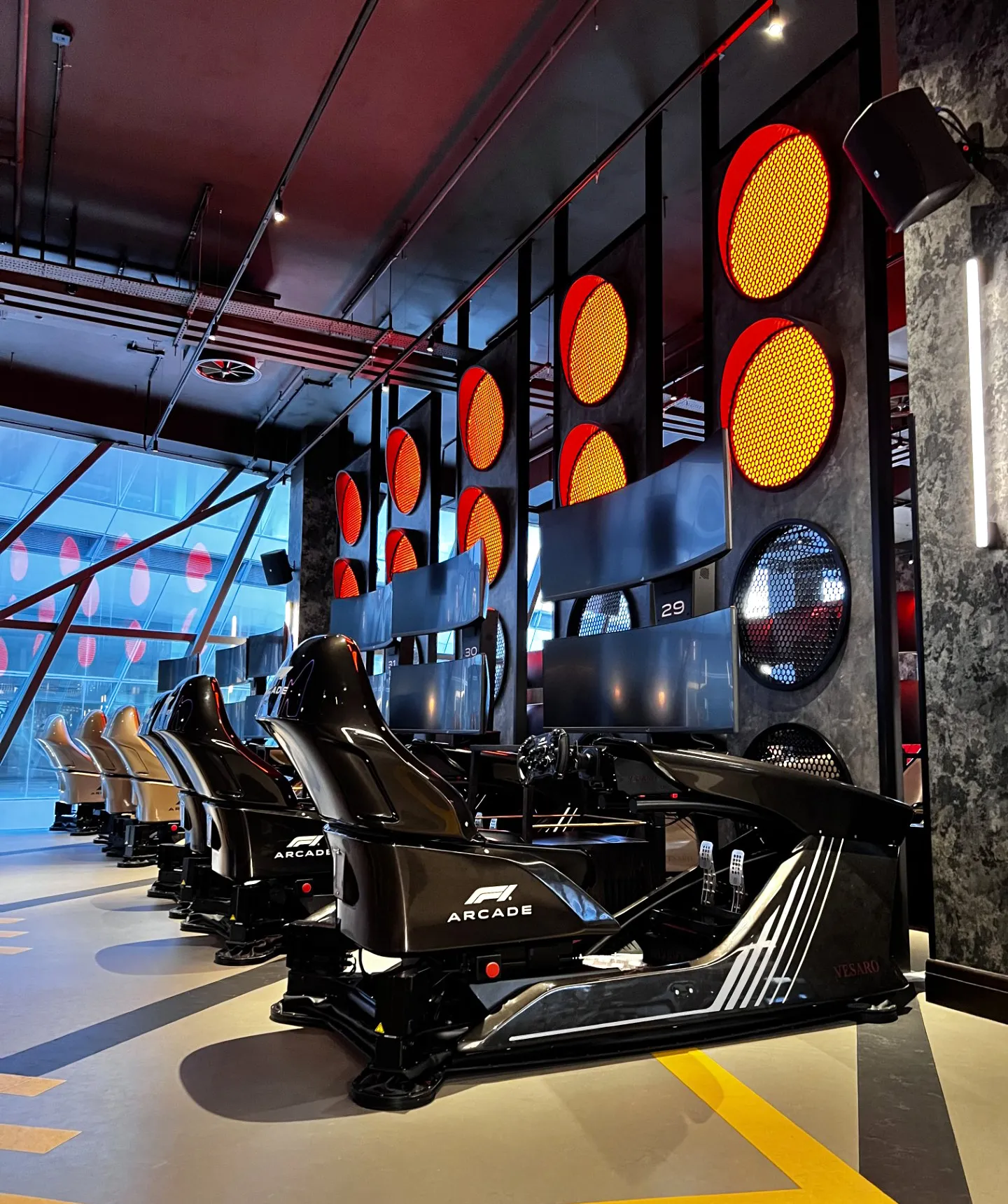 Rows of Vesaro V-Zero simulators inside an F1 Arcade venue