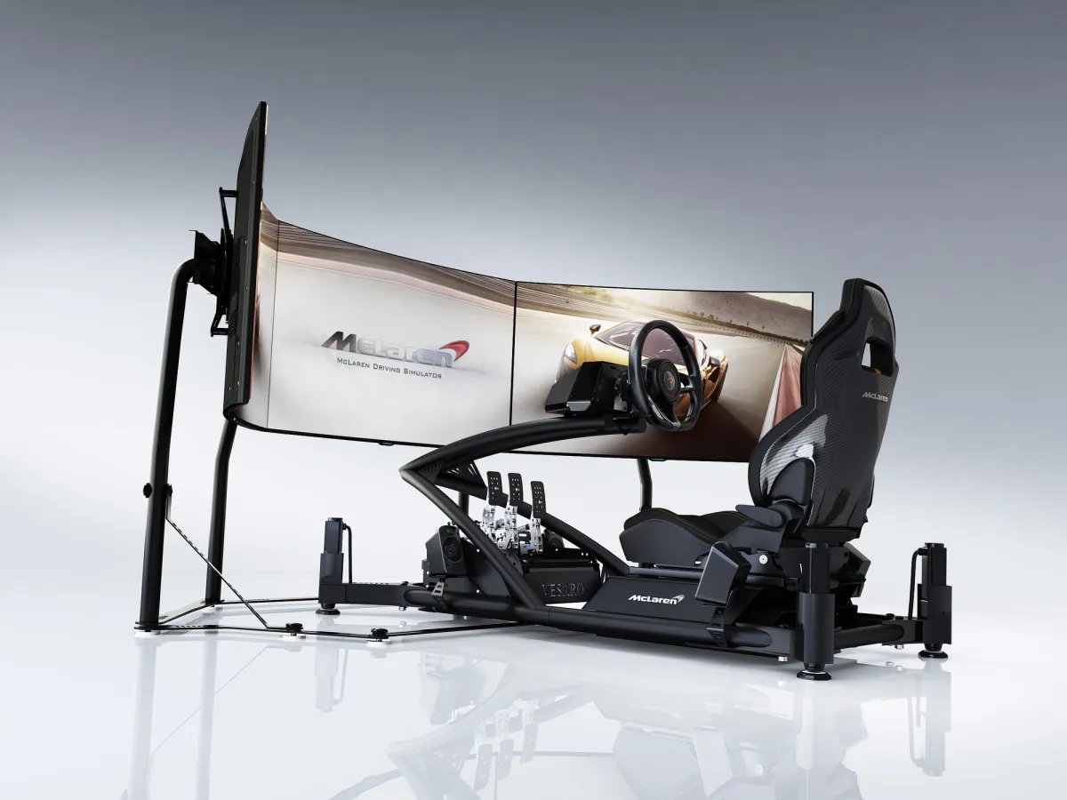 McLaren-branded triple-screen Vesaro racing simulator viewed from the right on a white studio floor