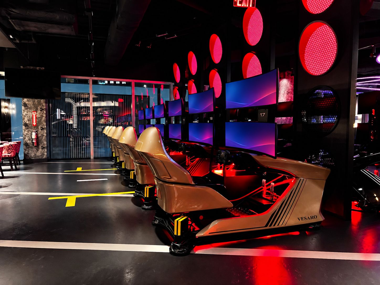 Rows of Vesaro V-Zero simulators inside an F1 Arcade venue