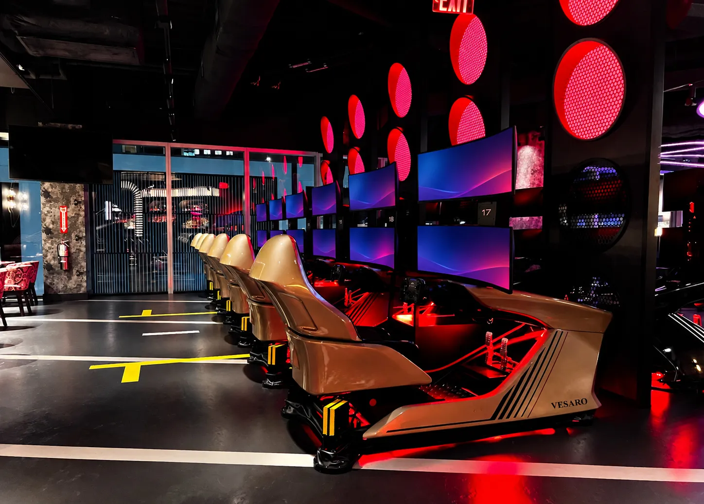 Rows of Vesaro V-Zero simulators inside an F1 Arcade venue