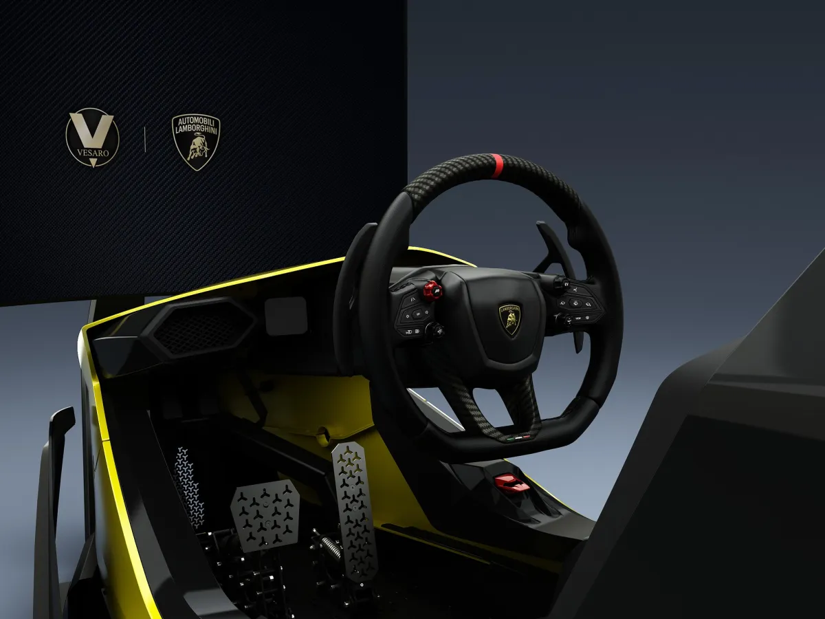 Lamborghini-branded Vesaro simulator cockpit with yellow trim, showing the steering wheel, pedals and Vesaro and Lamborghini logos
