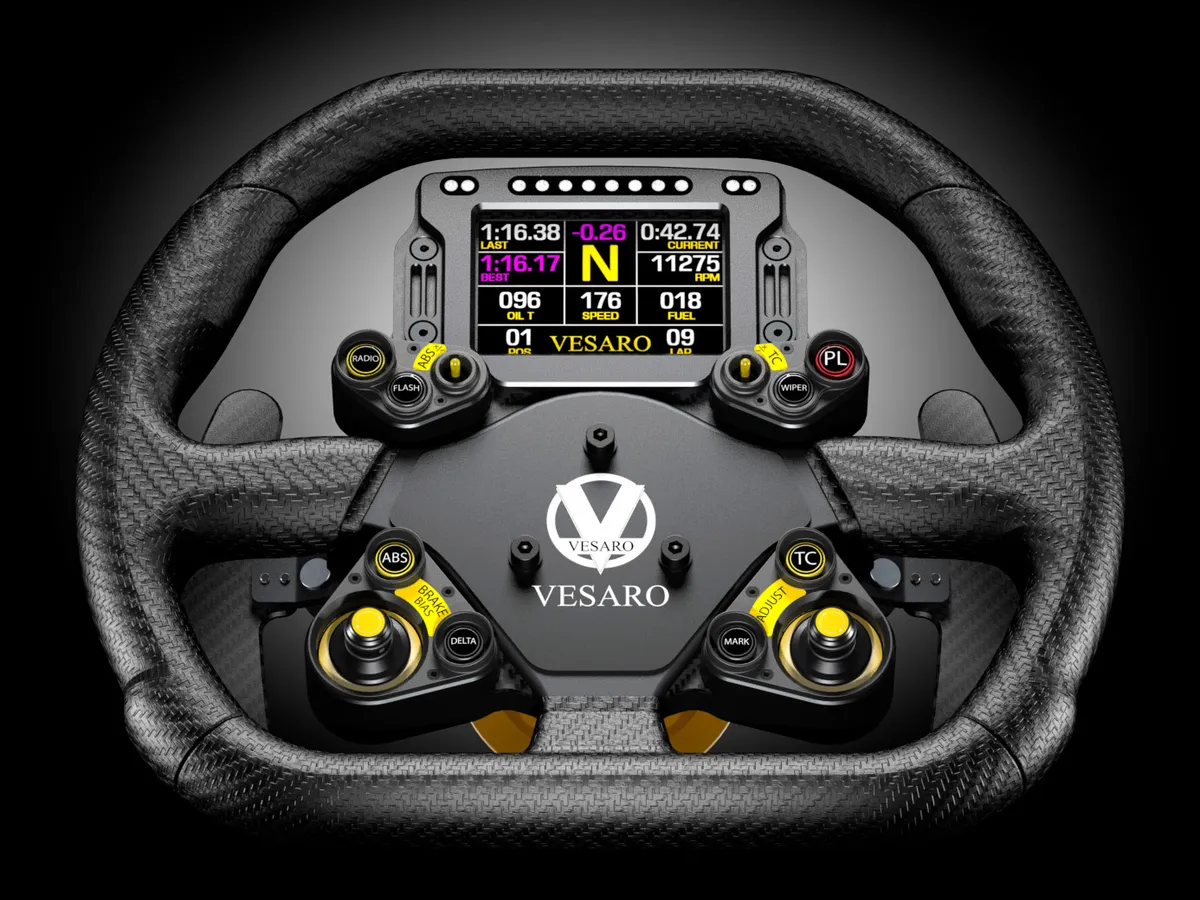 Carbon fibre GT-style steering wheel with the Vesaro logo, a colour dash display and yellow switches