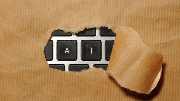 A piece of cardboard with a keyboard appearing through it