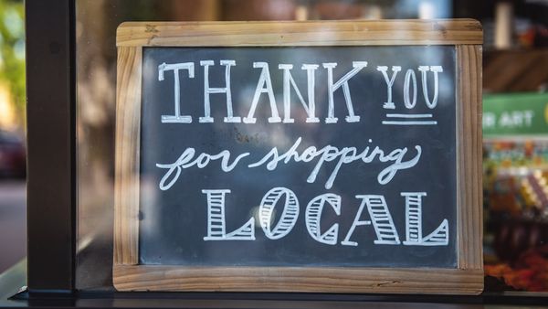 shallow focus photo of thank you for shopping signage