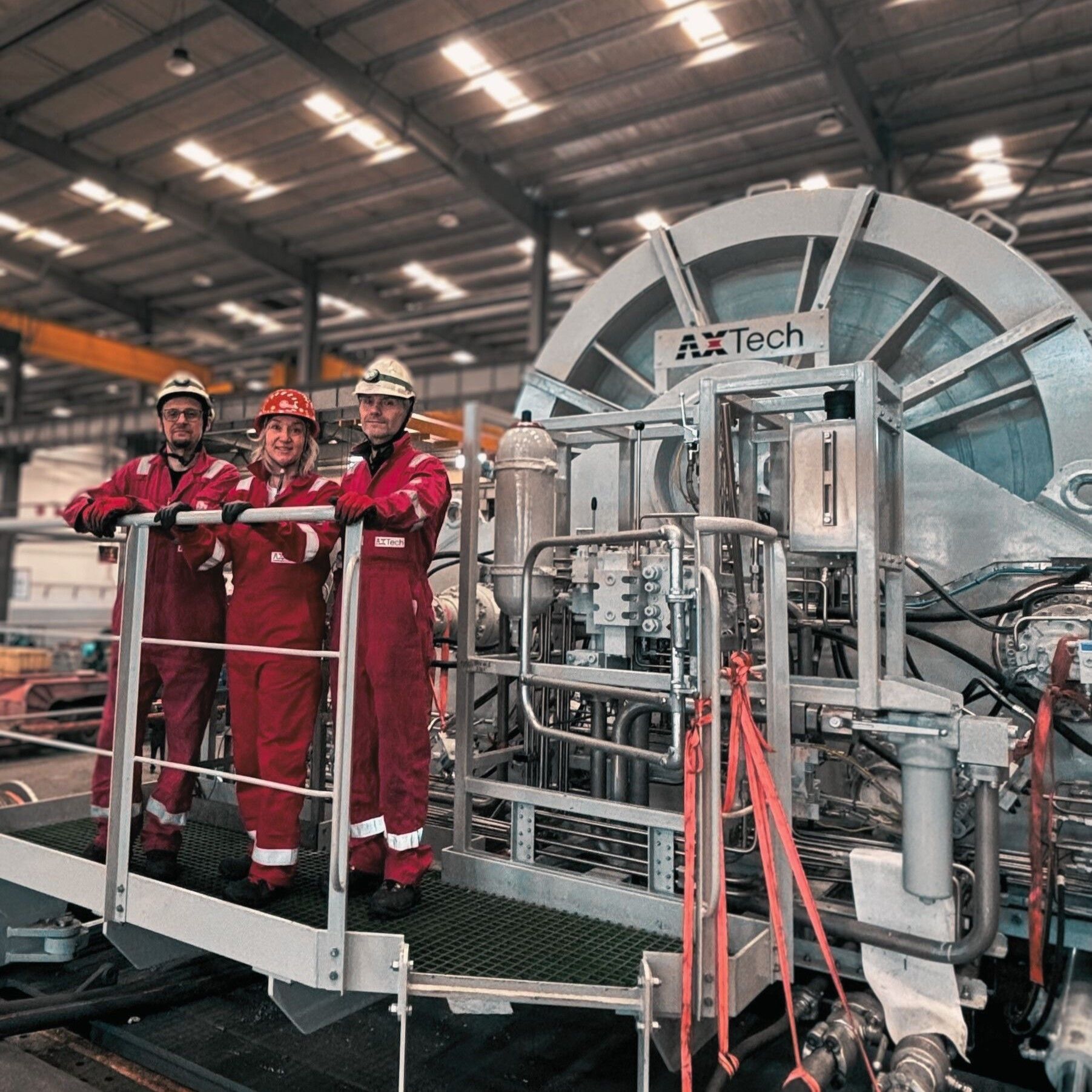 Riser pull inn winch with people standing in front of it