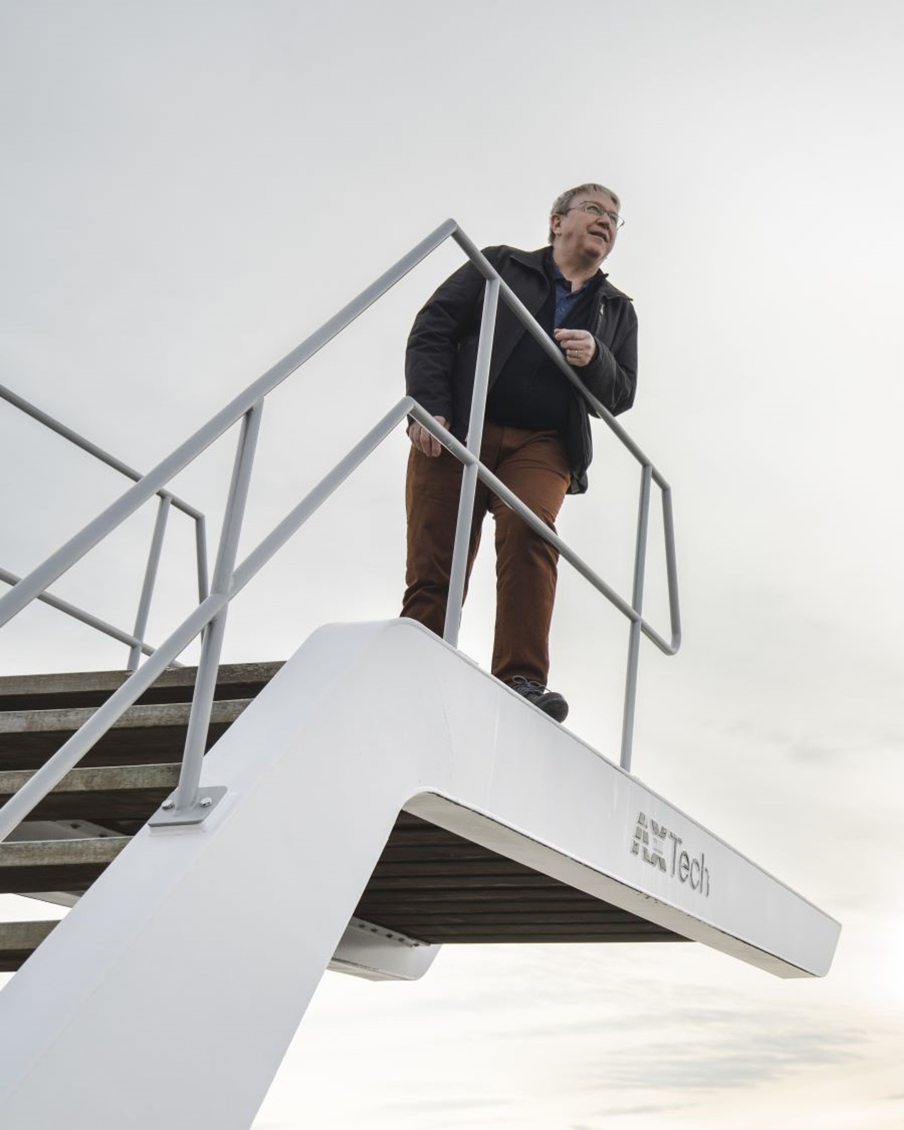 Man standing on steel construction