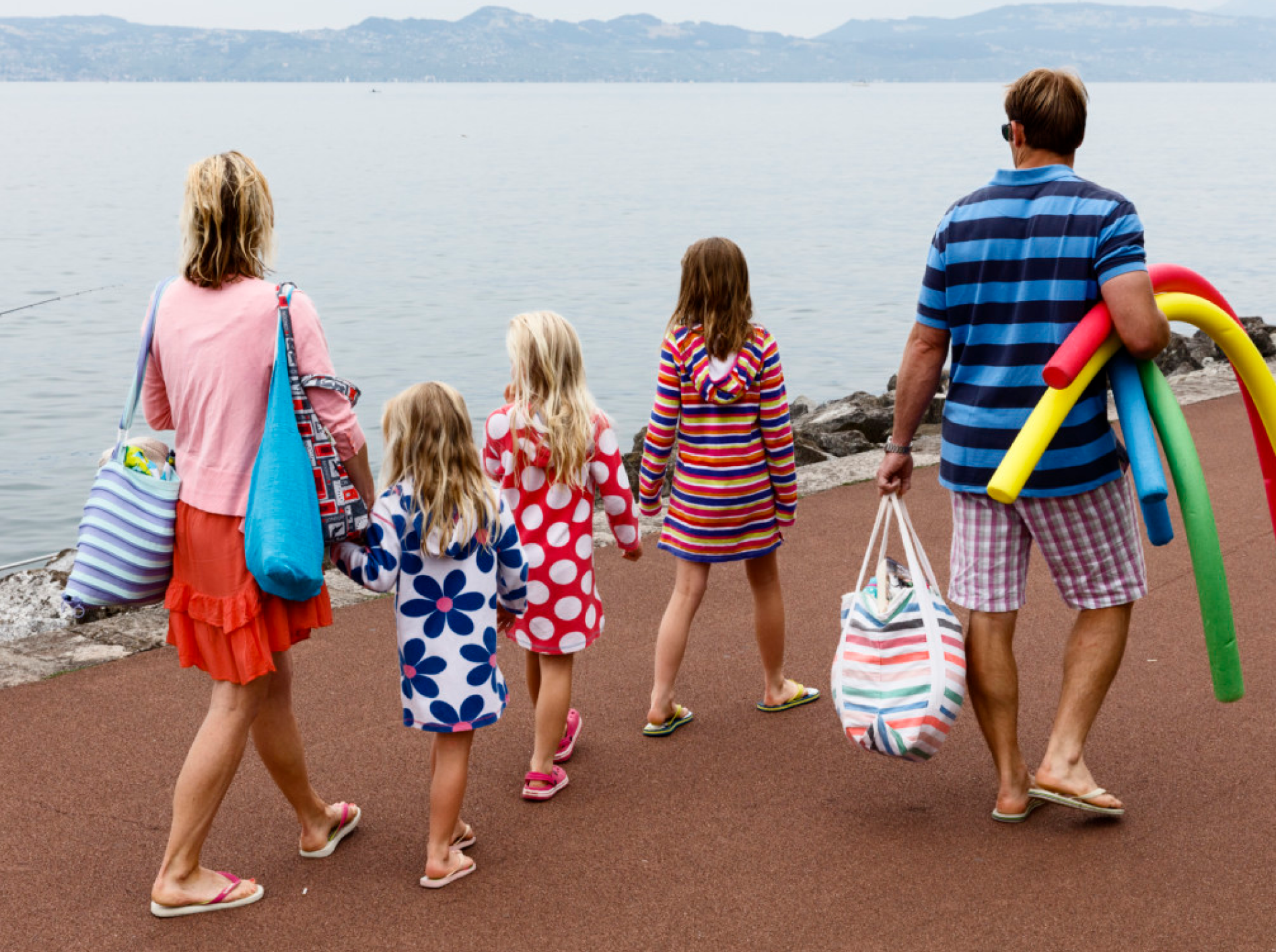 A family walking along the beach