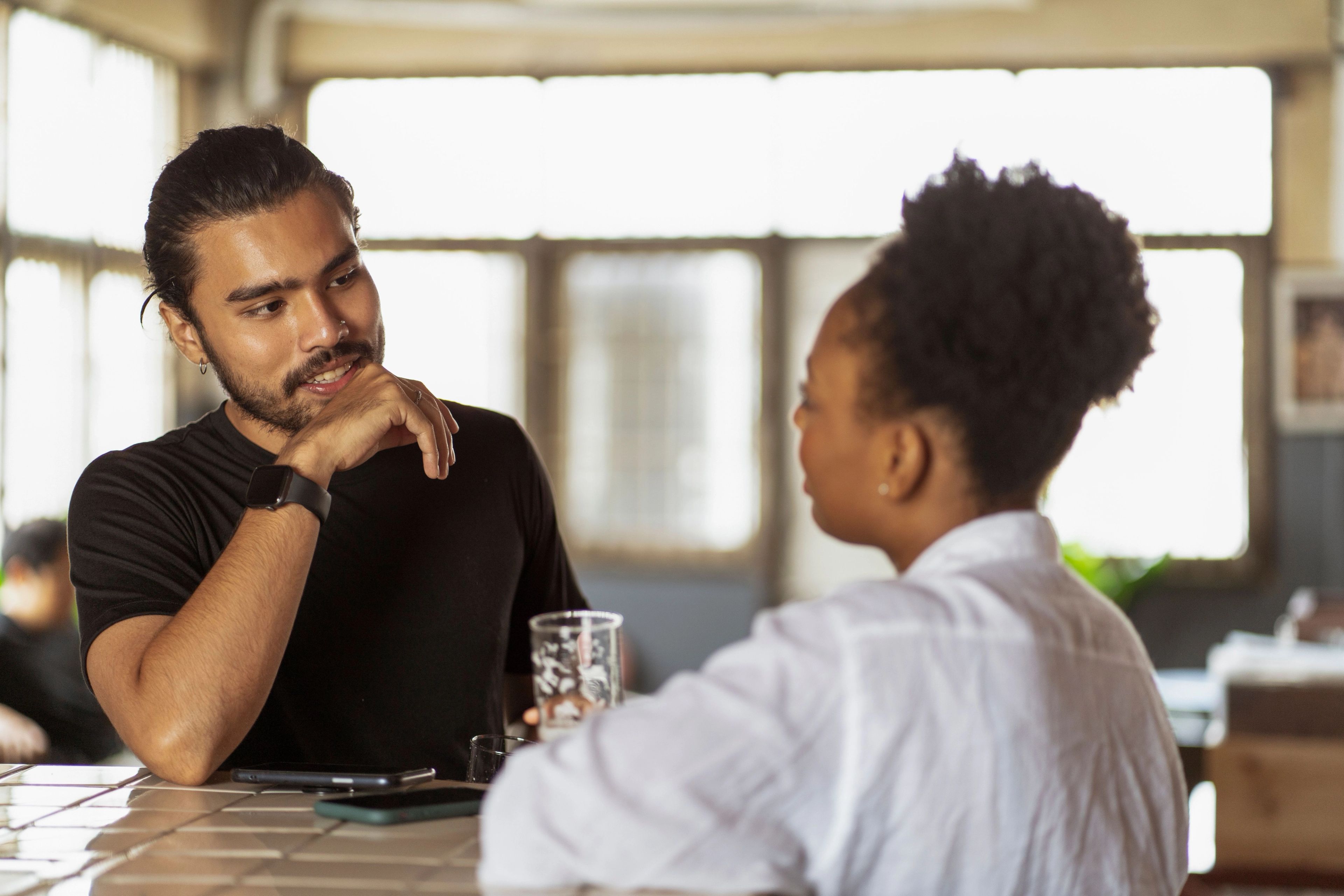 Young man talking to family