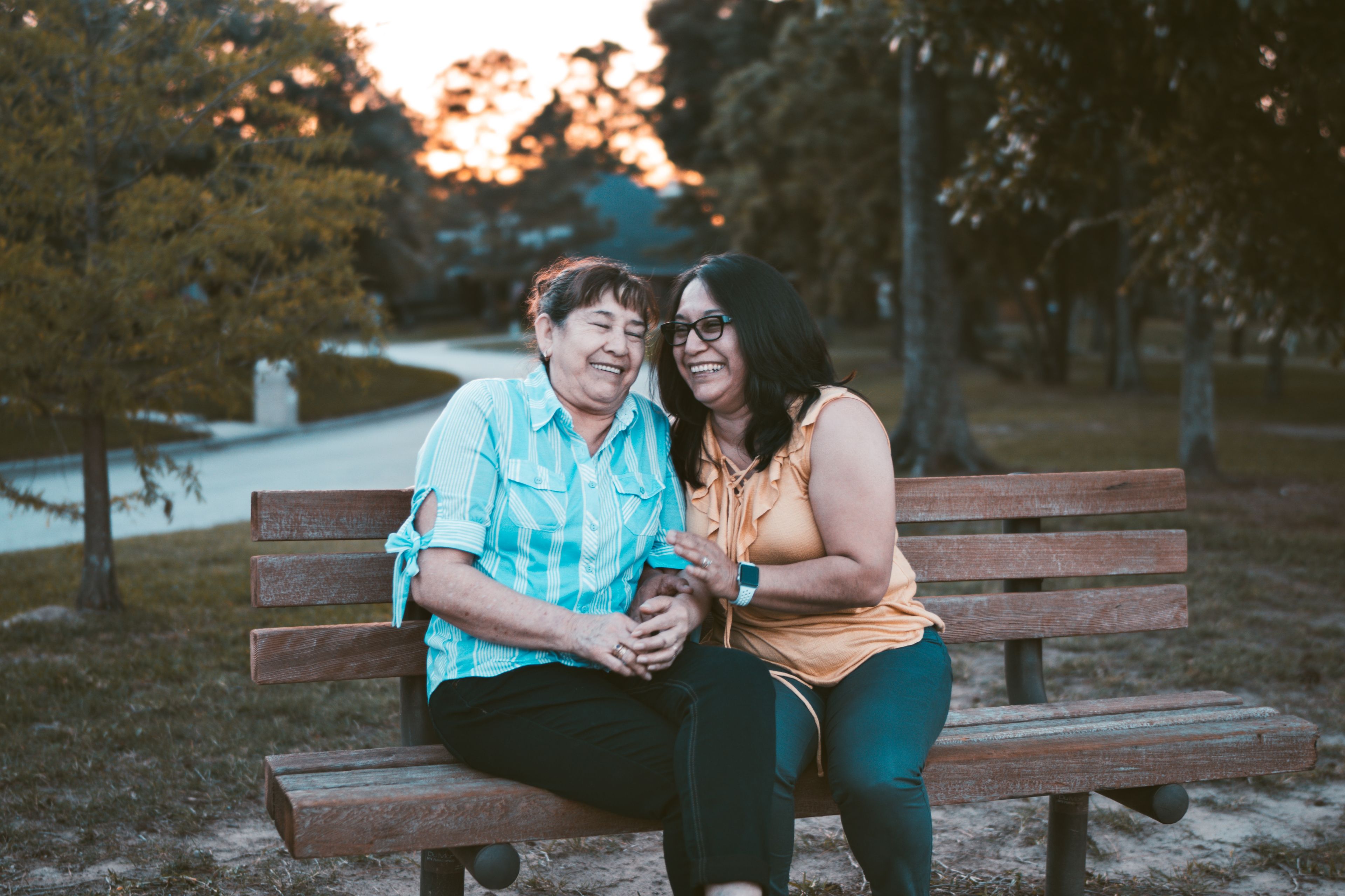 two adult family members on bench