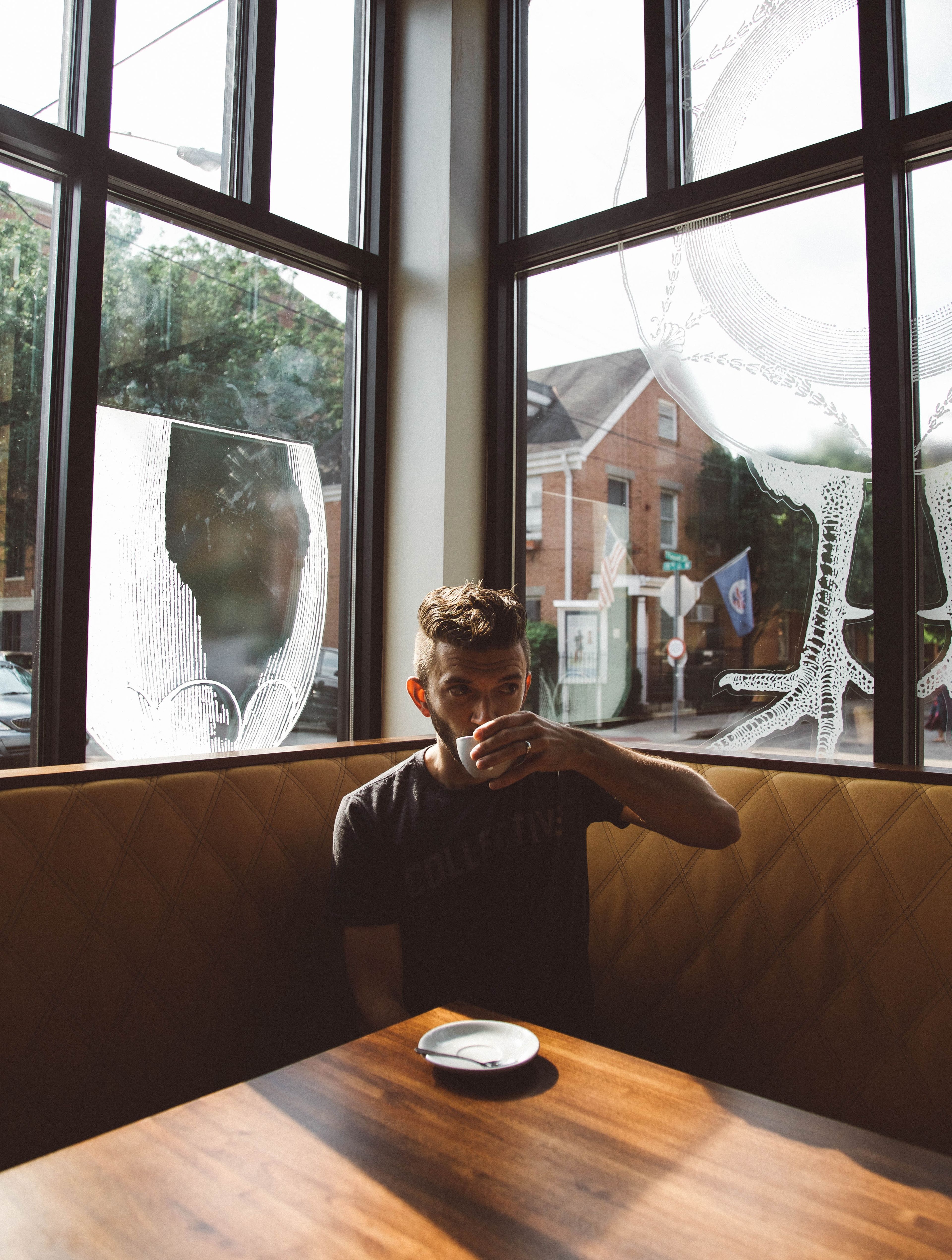 man drinking coffee and thinking about his family 