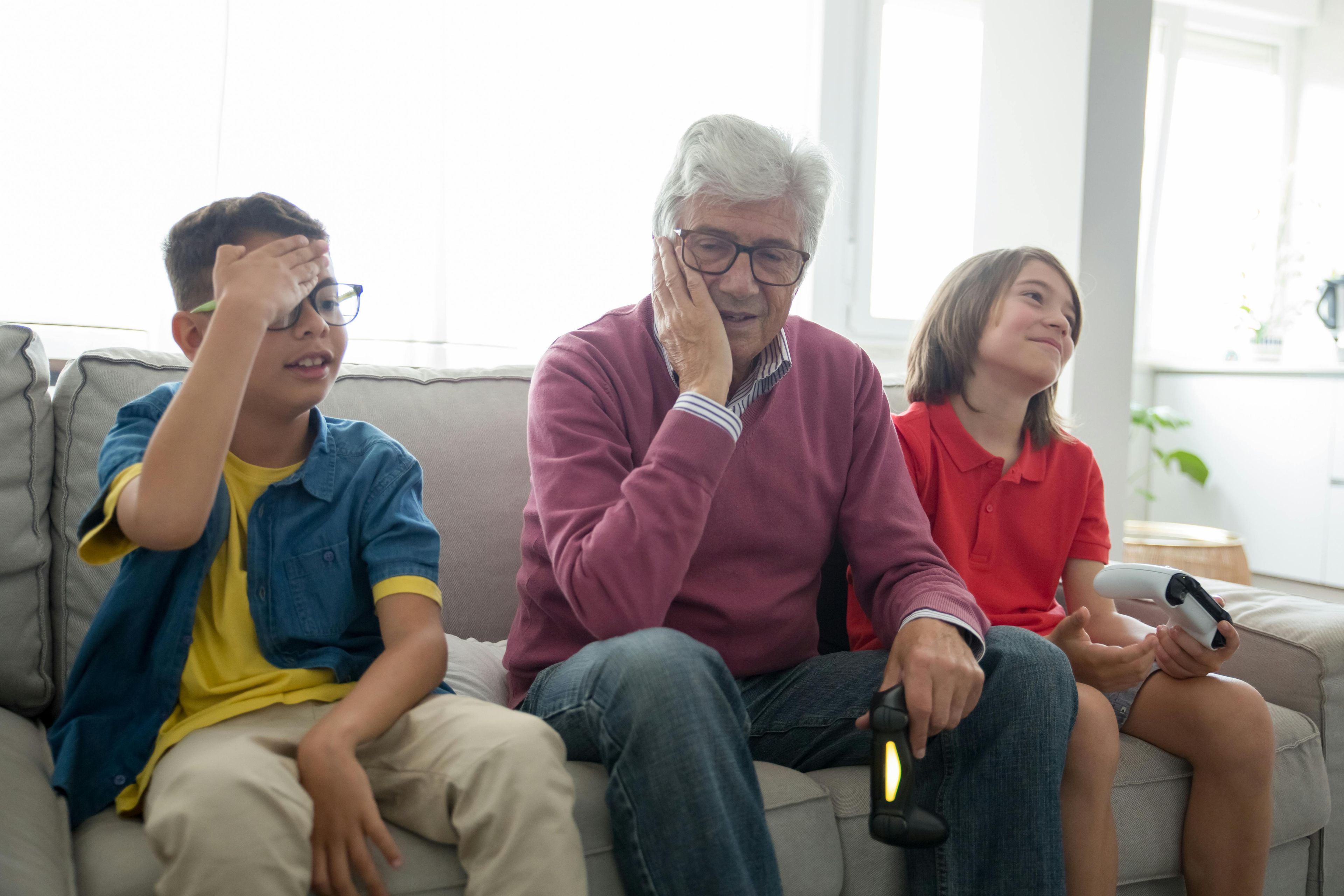 Grandparent playing video games with grandkids