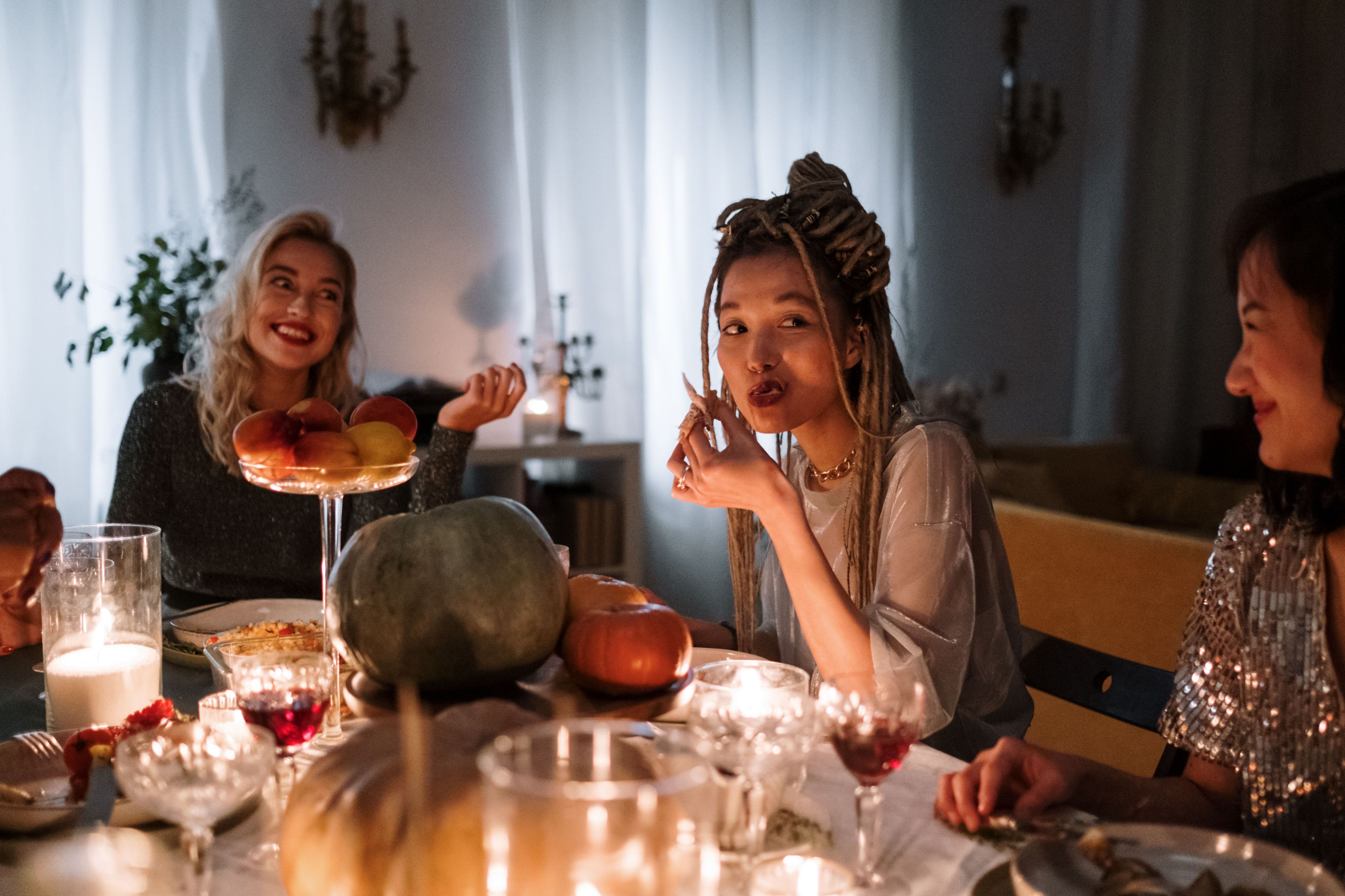 Young woman eating dinner with family