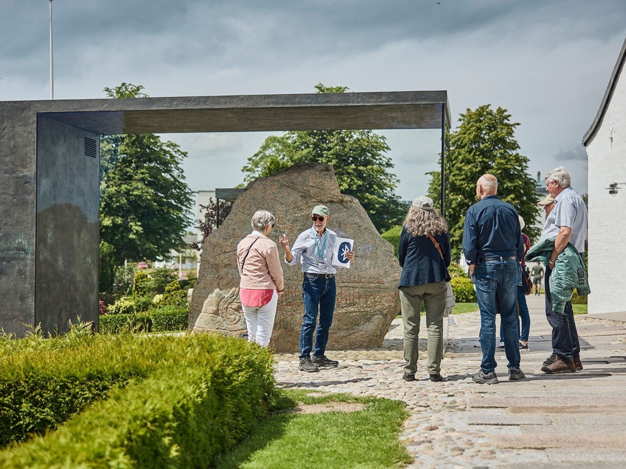 Guided tour in front of the Jelling stones