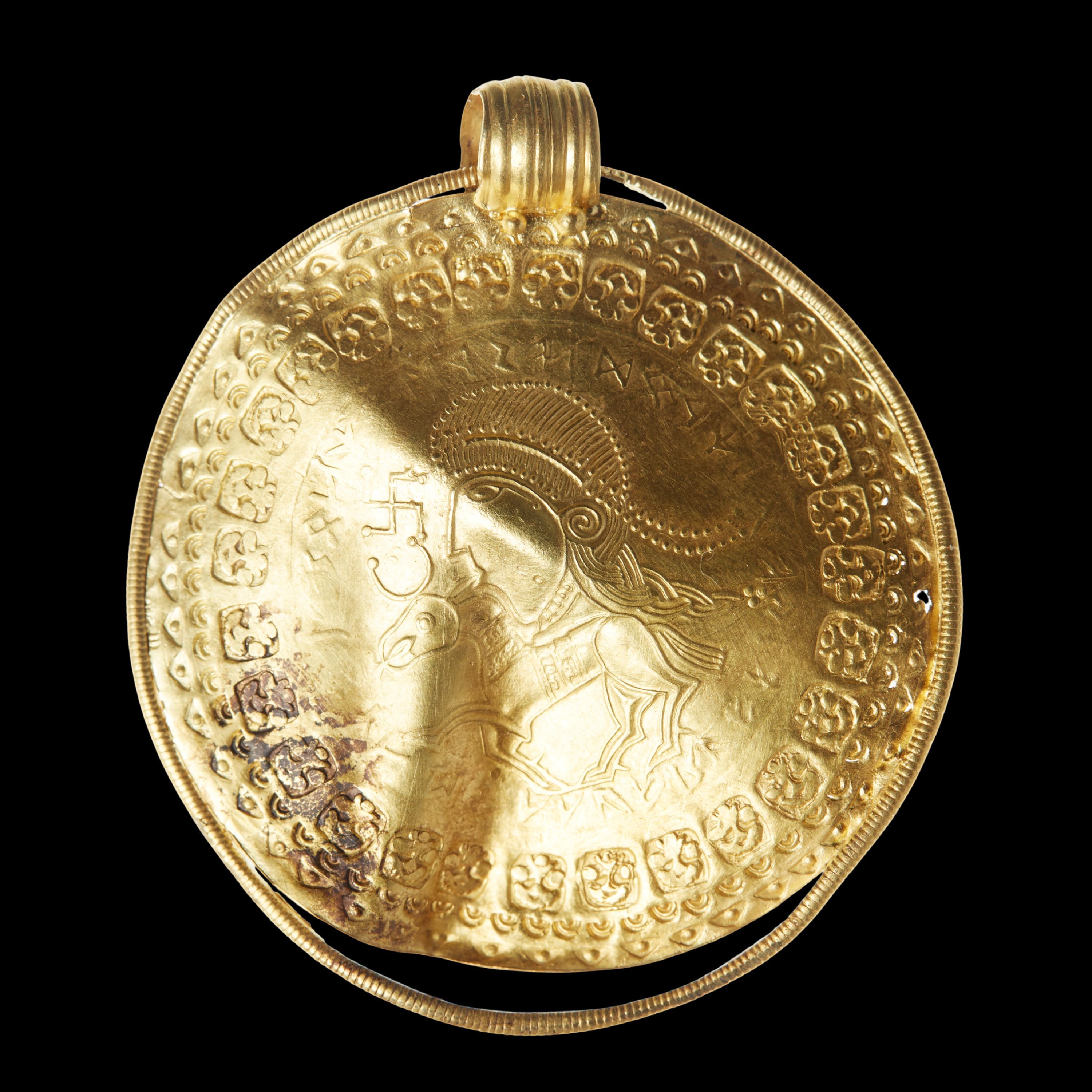 Gold piece with horse and face