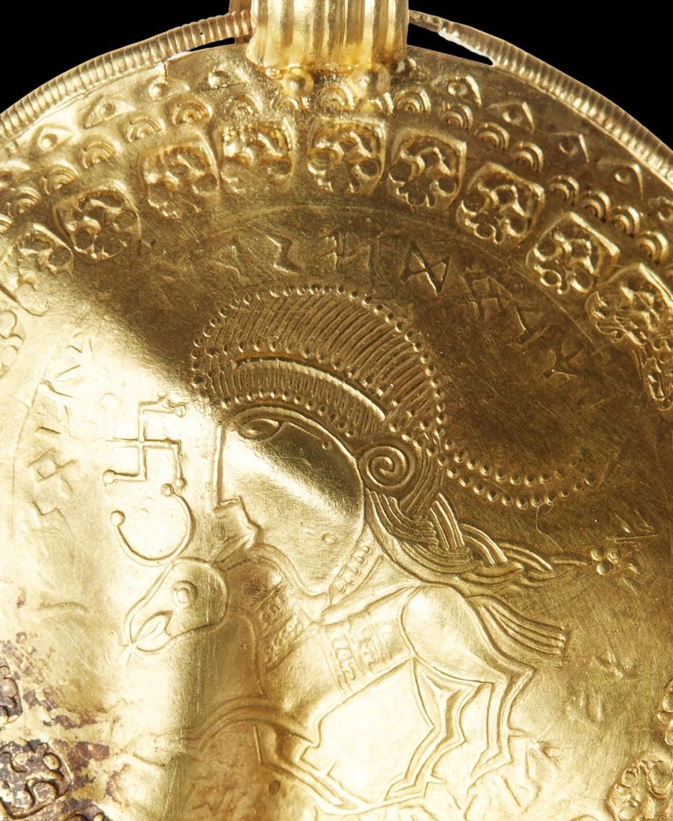 Guldstykke med hest og ansigt