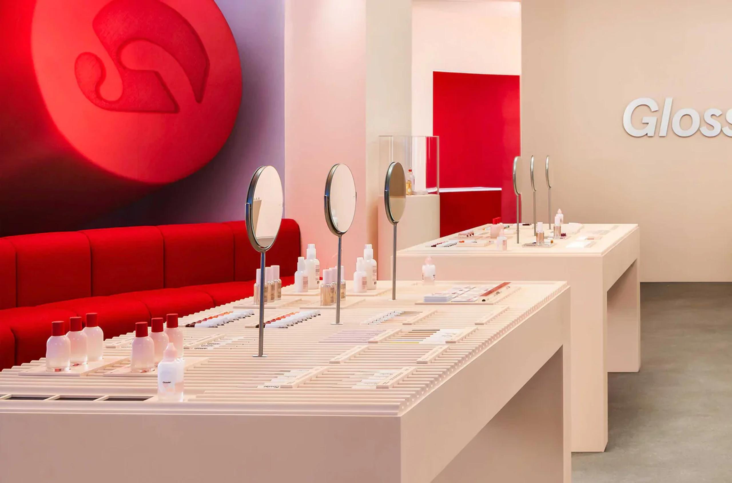 The interior of Glossier's London store is a pink wonderland, offering a dreamy and inviting space for beauty enthusiasts.