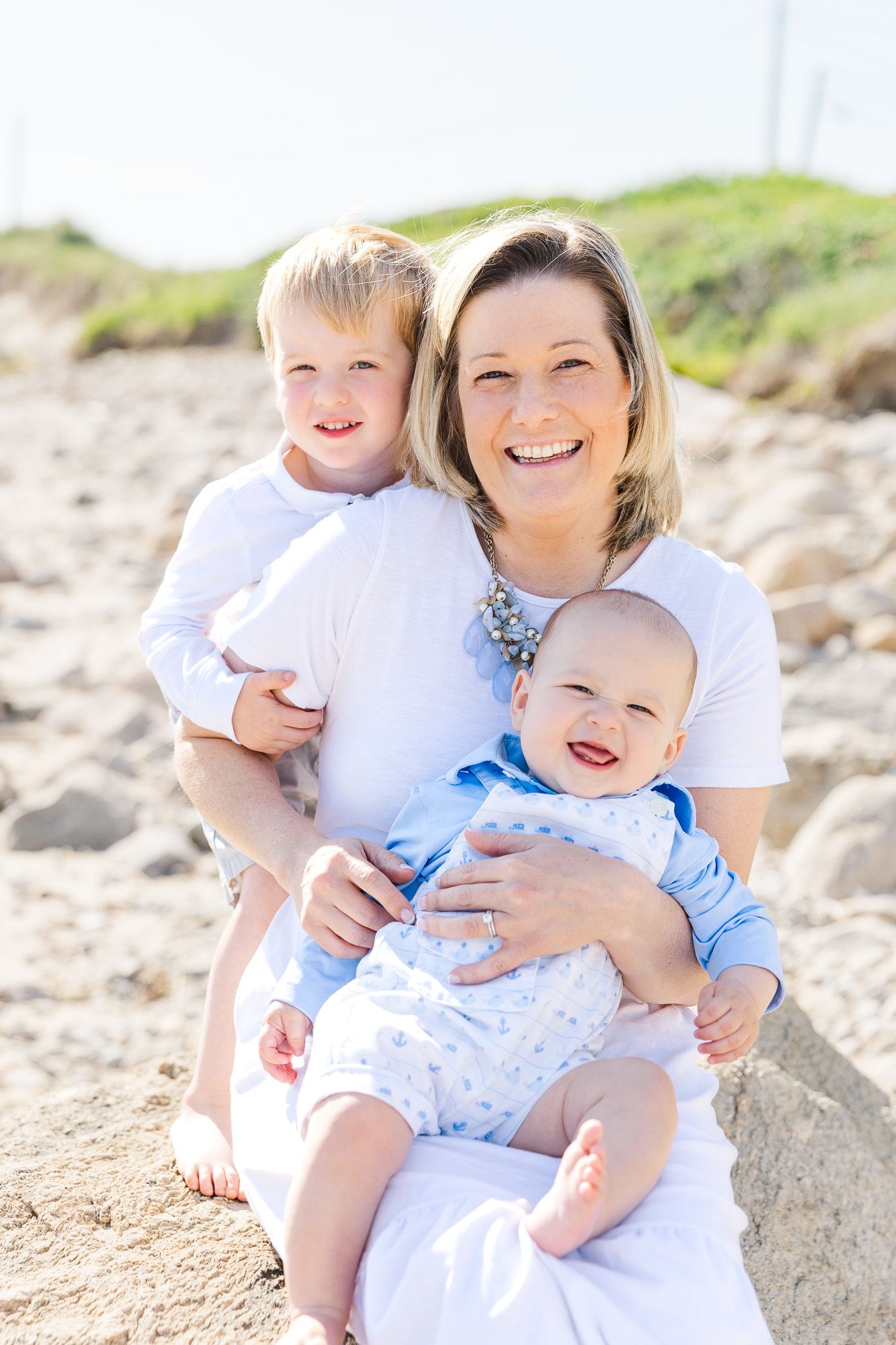 Mom and sons on the beach at Elephant Rock in Westport, MA