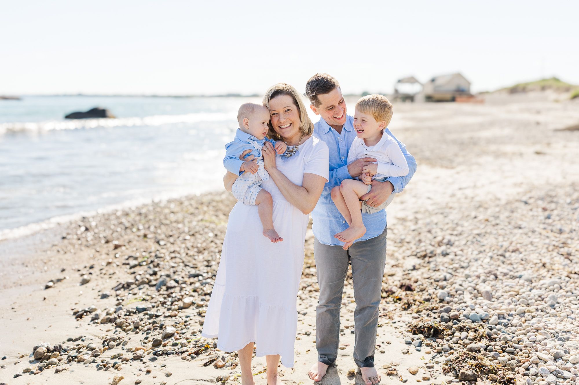 family on the beach on a beautiful june day at Elephant Rock Beach in Westport, MA