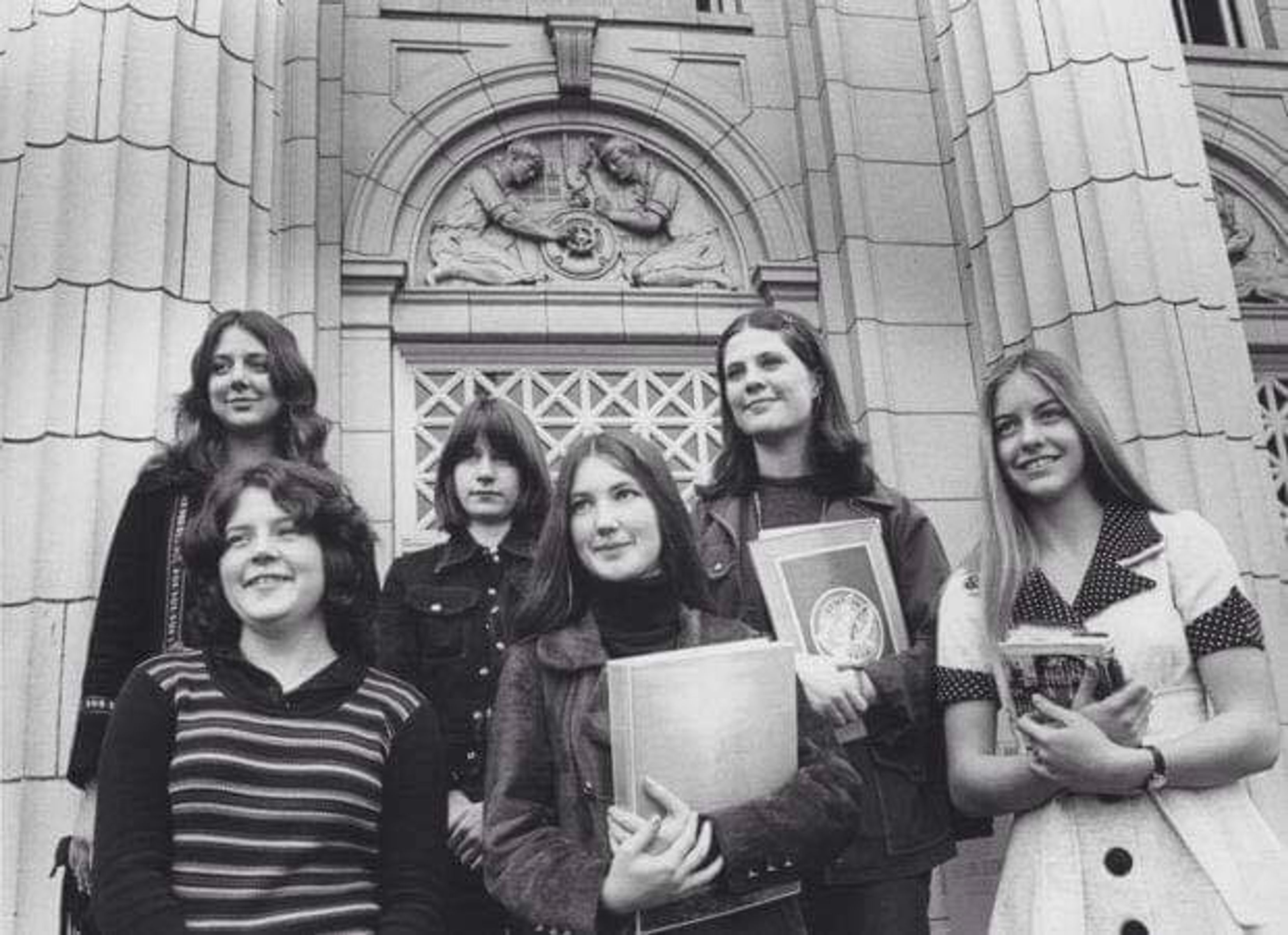 The first six girls of Benson pose on the front steps.