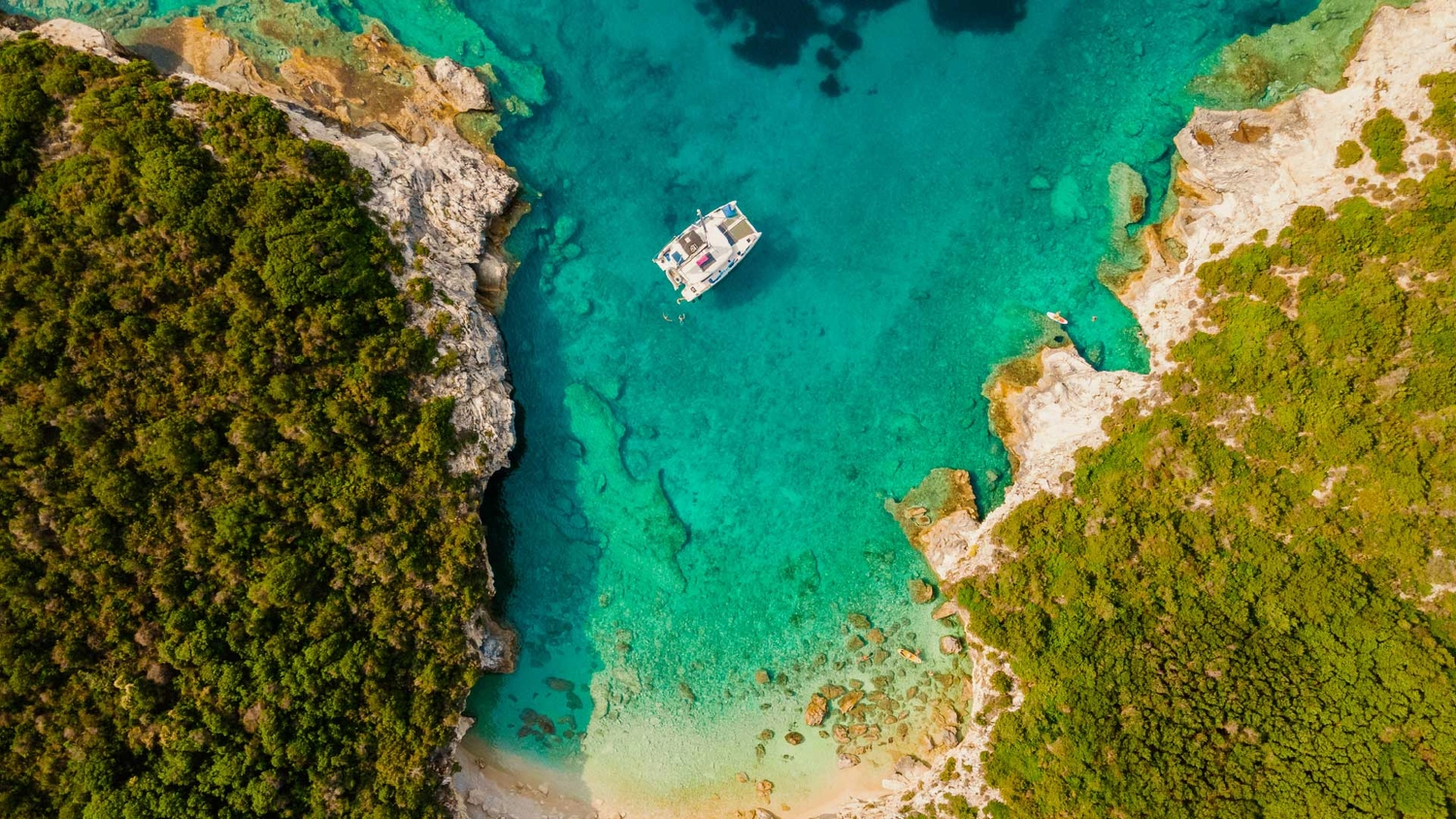 Catamaran anchored in a beautiful blue bay