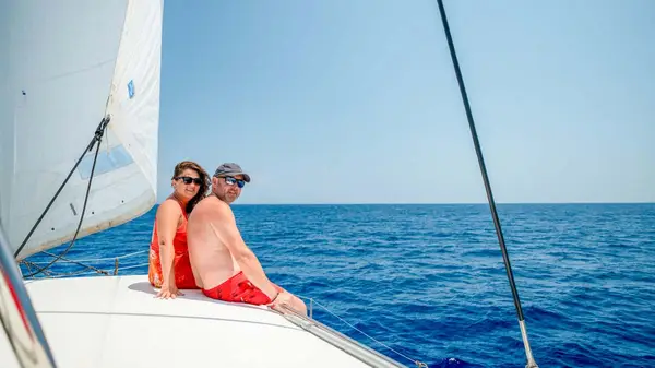 Couple on a yacht in Greece