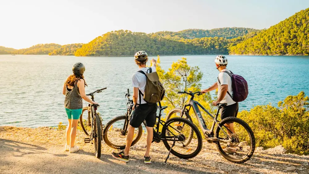 Group of cyclists admire the view in Mljet National Park