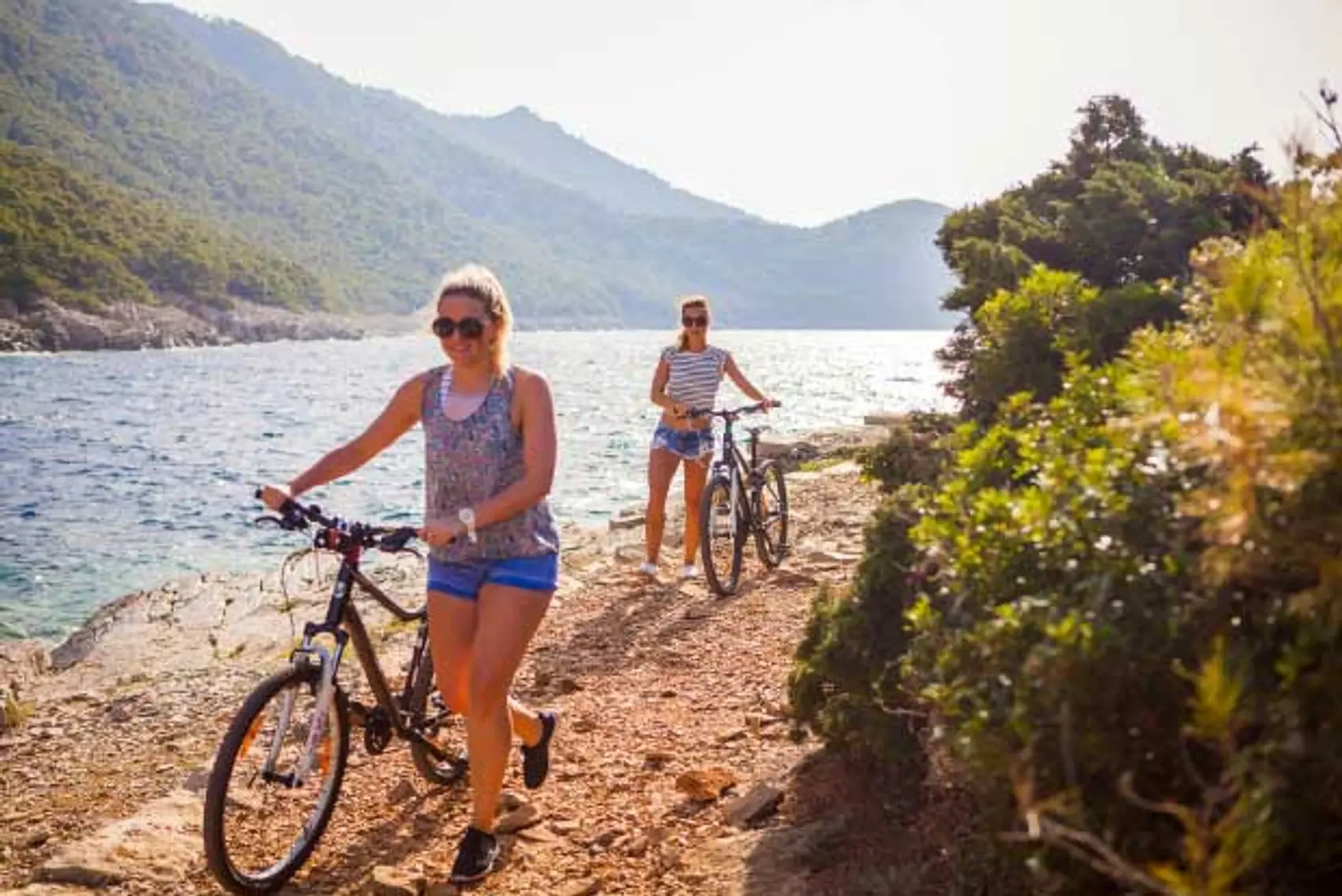 two women cycling Mljet National Park in Croatia