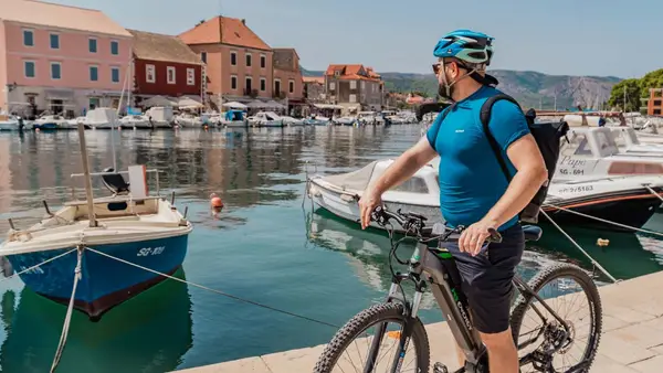 Cyclist in Stari Grad Old Town in Hvar