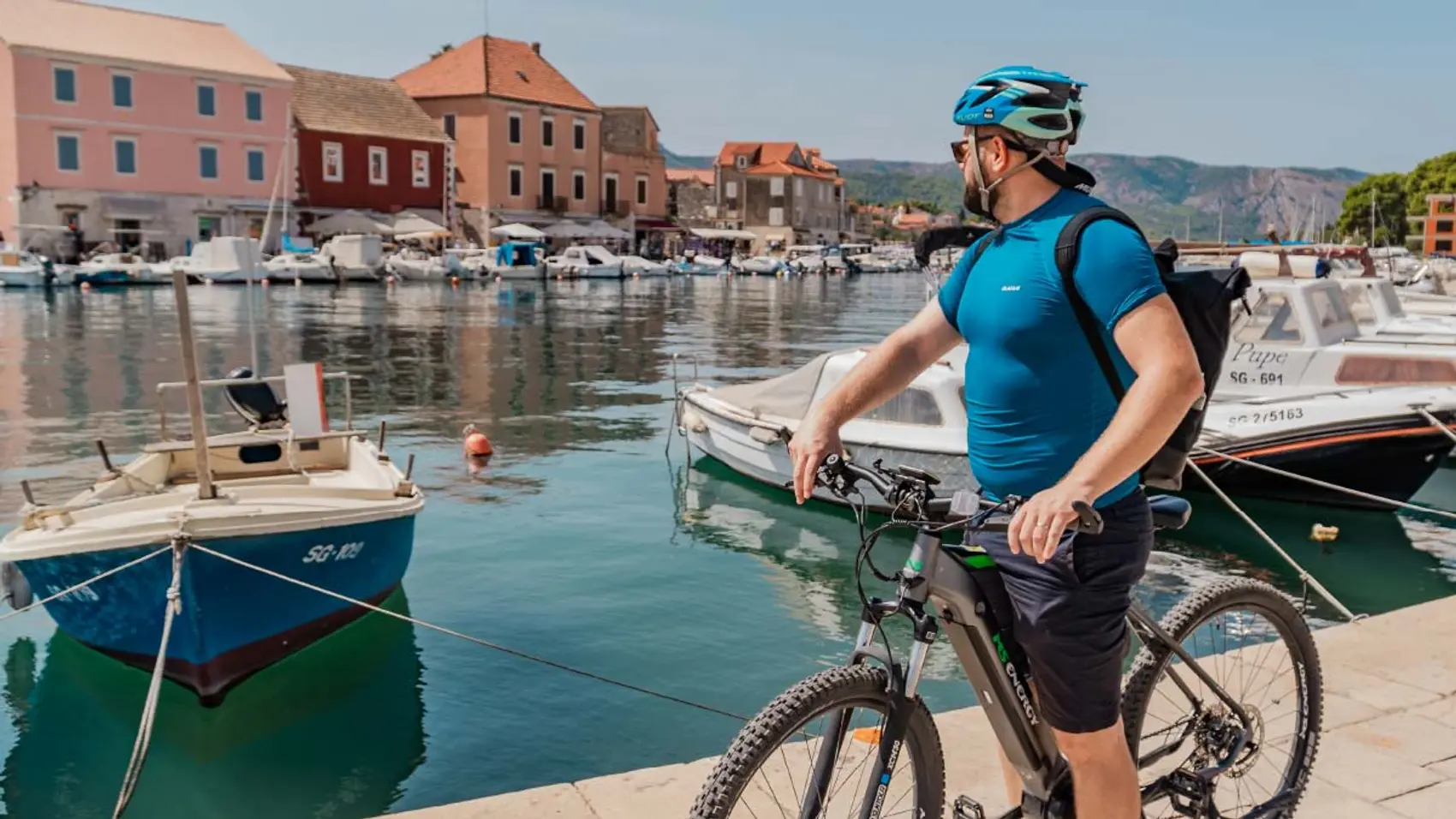 Cyclist in Stari Grad Old Town in Hvar