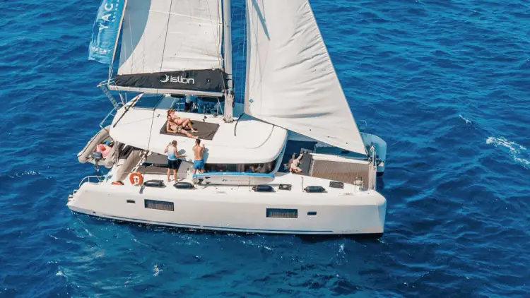 A premium sailing catamaran holiday with a group of travellers enjoying the Mediterranean life.