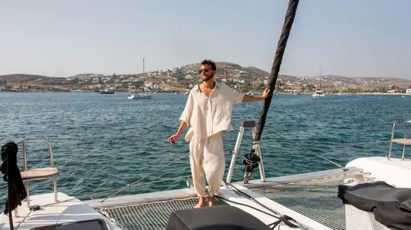 Man standing on a catamaran in Paros