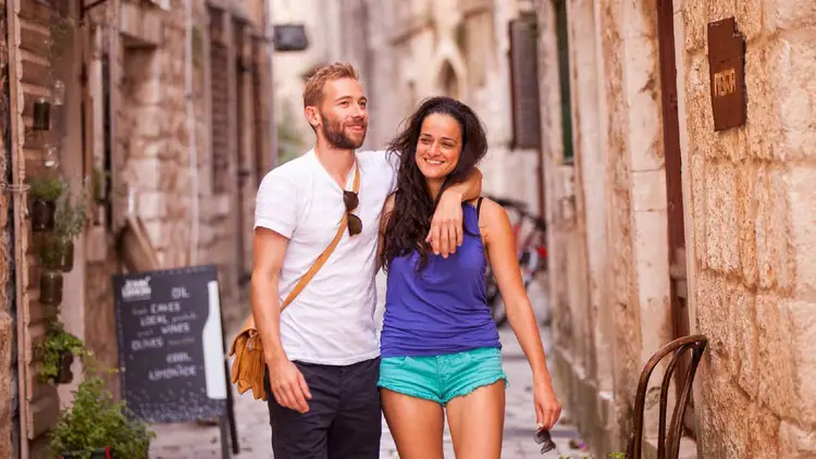 Couple walking the streets of Stari Grad in Croatia