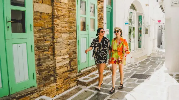 Two women walk the streets of Naxos