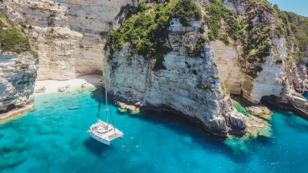 Luxury Catamaran at anchor off of Paxos Island in the Ionian Sea of Greece.