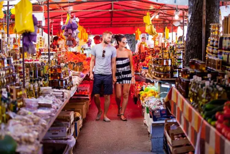 Picture of a couple walking through a local Croatian food market