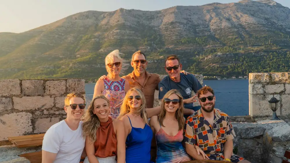 Group of people pose for a photo at Massimo's Cocktail bar in Korcula